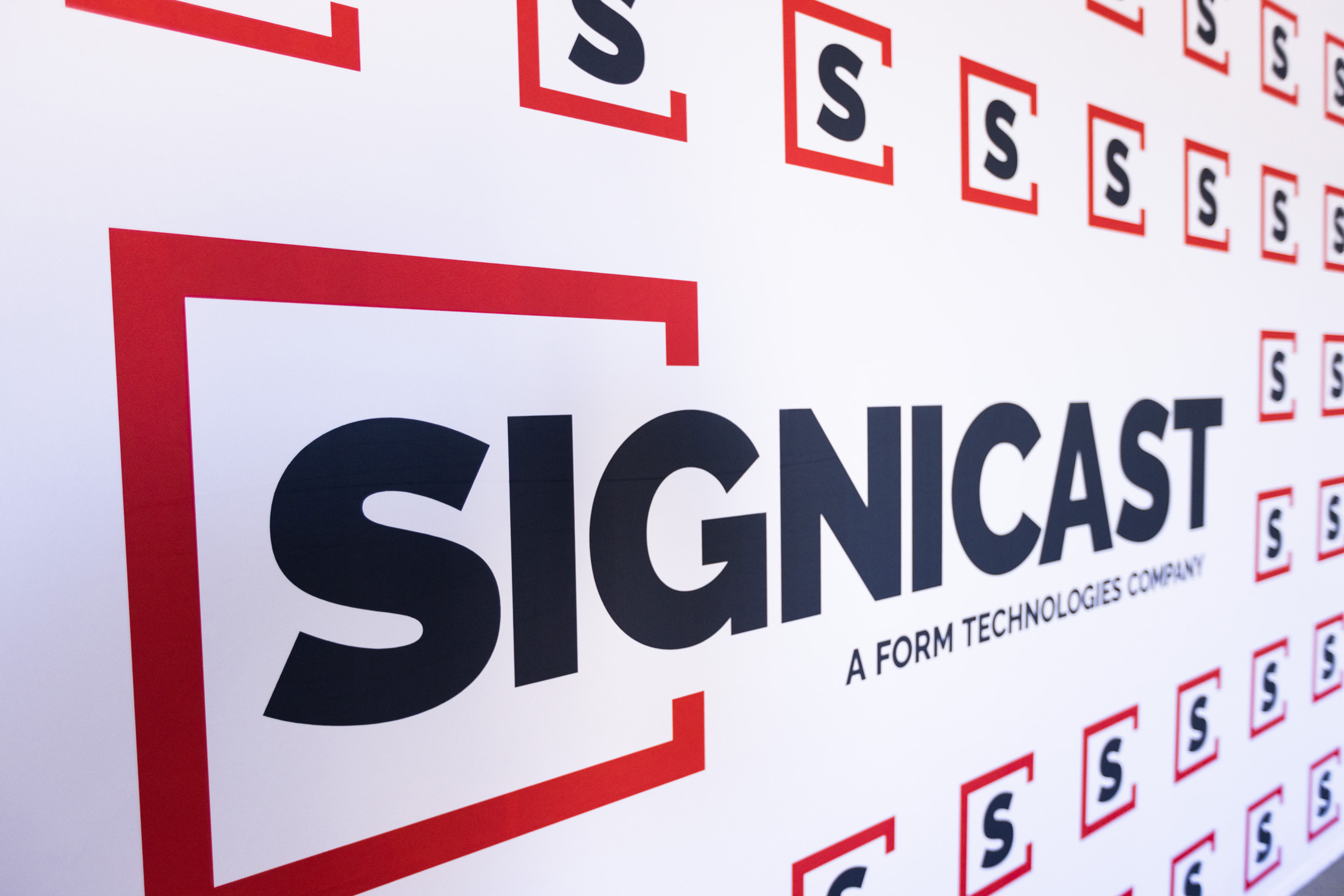 Signcast logos on a wall at the MFC ribbon cutting event